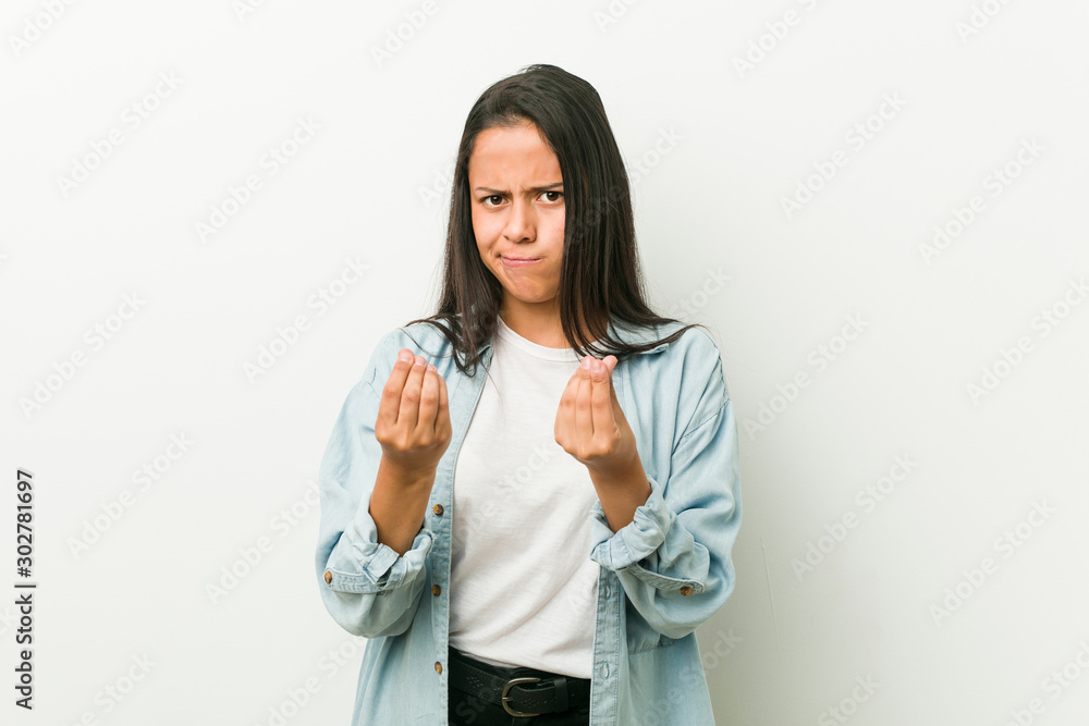 Young hispanic woman showing that she has no money.