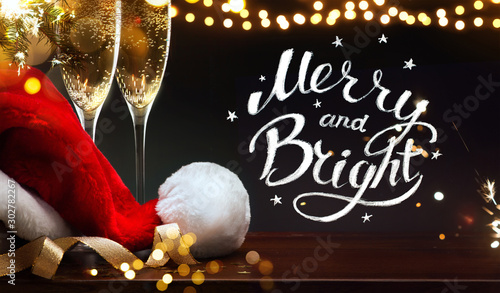 Slika na platnu merry Christmas and happy New year; champagne and Santa hat
