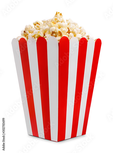 Delicious popcorn in decorative paper popcorn bucket isolated on white background.