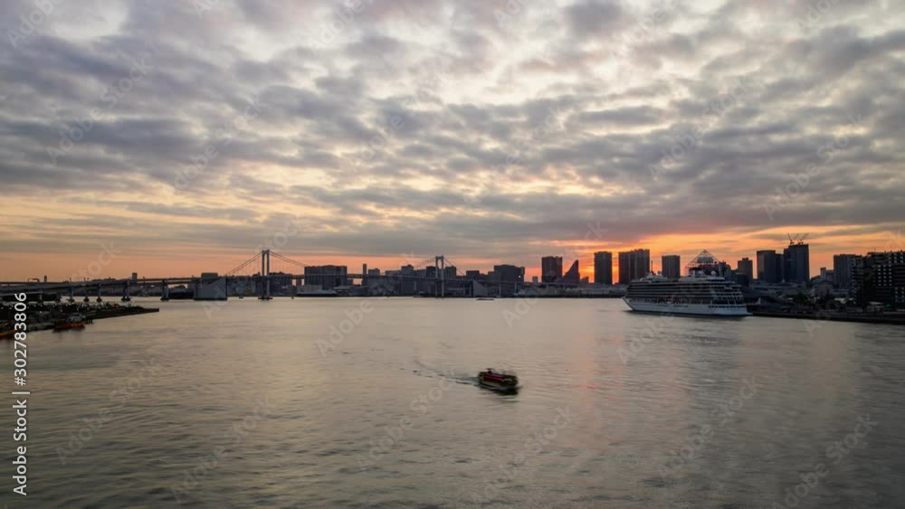 4K UHD time lapse of sunset over Tokyo city with twilight cloudy sky near Odaiba area. 4K UHD time lapse of sunset over Tokyo city with twilight cloudy sky near Odaiba area.