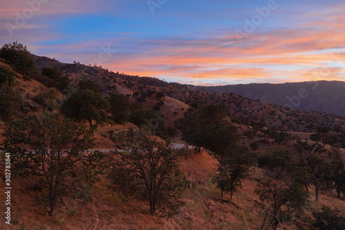 Southern California landscape at twilight including a road and beautiful sky.