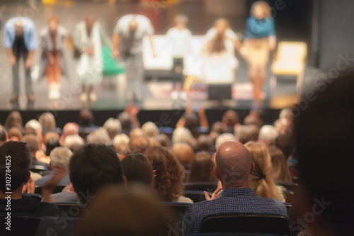 people watching play at the theater