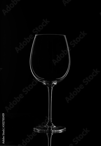 Empty wine glass isolated on a dark background