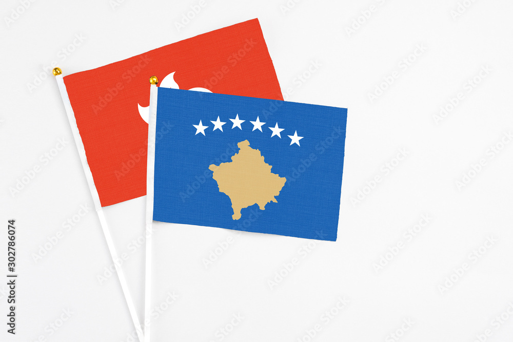 Kosovo and Hong Kong stick flags on white background. High quality fabric, miniature national flag. Peaceful global concept.White floor for copy space. Kosovo and Hong Kong stick flags on white background. High quality fabric, miniature national flag. Peaceful global concept.White floor for copy space.