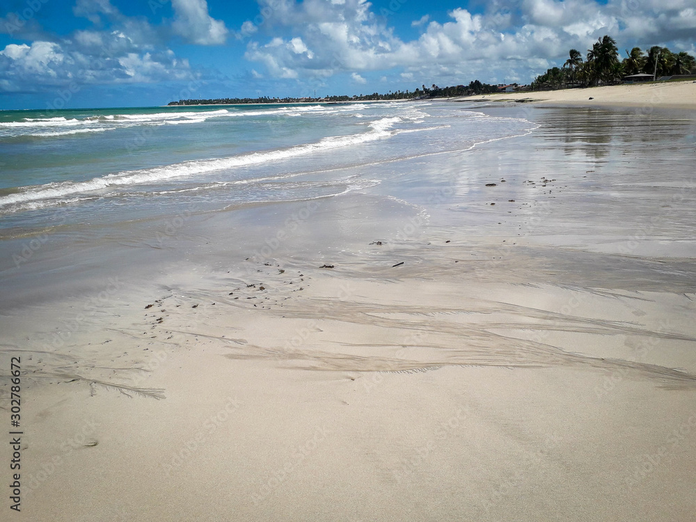Sand and ocean Carneiros Beach, Pernambuco, Brazil
