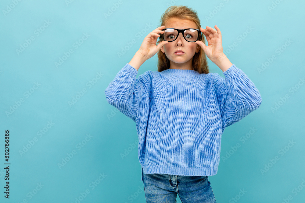 child with glasses and low vision on a blue background child with glasses and low vision on a blue background