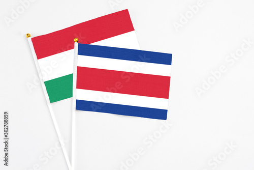 Costa Rica and Hungary stick flags on white background. High quality fabric, miniature national flag. Peaceful global concept.White floor for copy space. Free Download Costa Rica and Hungary stick flags on white background. High quality fabric, miniature national flag. Peaceful global concept.White floor for copy space. - GFXLoad