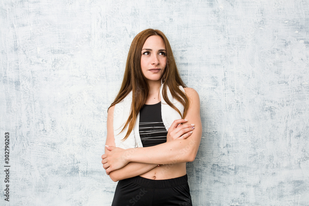 Young fitness woman smiling confident with crossed arms. Young fitness woman smiling confident with crossed arms.