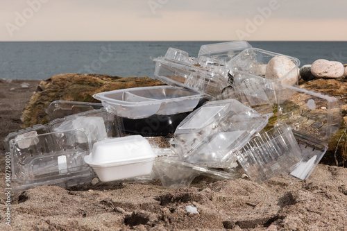 Fototapet plastic take out food clam shells and clear plastic fruit packaging polluting a