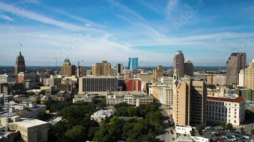 4K San Antonio Skyline Drone Dolly Right Afternoon Blue Sky Texas Flag Hotel