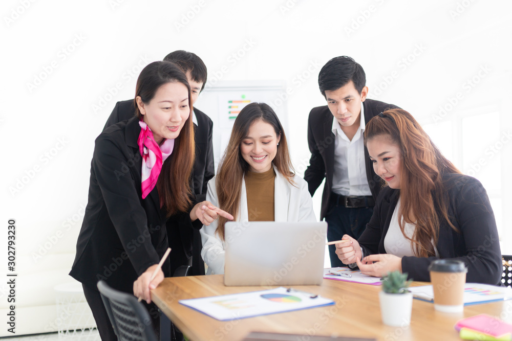 asian female officer present about organization business profits to her teams with laptop, they discussion about performance and result, innovation and development, happiness workplace asian female officer present about organization business profits to her teams with laptop, they discussion about performance and result, innovation and development, happiness workplace