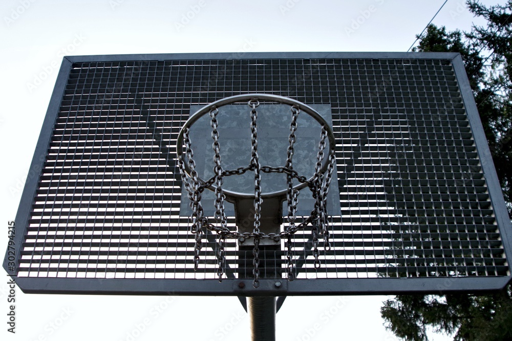 Metal basketball backboard with hoop and steel chains net in the park Stock  Photo | Adobe Stock