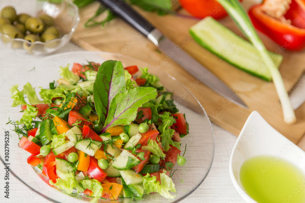 Fresh colorful vegetable salad in plate. Cooking healthy diet food