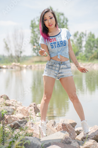 Beautiful asian girl posing in the American Independence Day