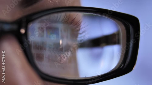 Wallpaper Mural female eye with glasses macro shot reflection surfing the internet via laptop Torontodigital.ca