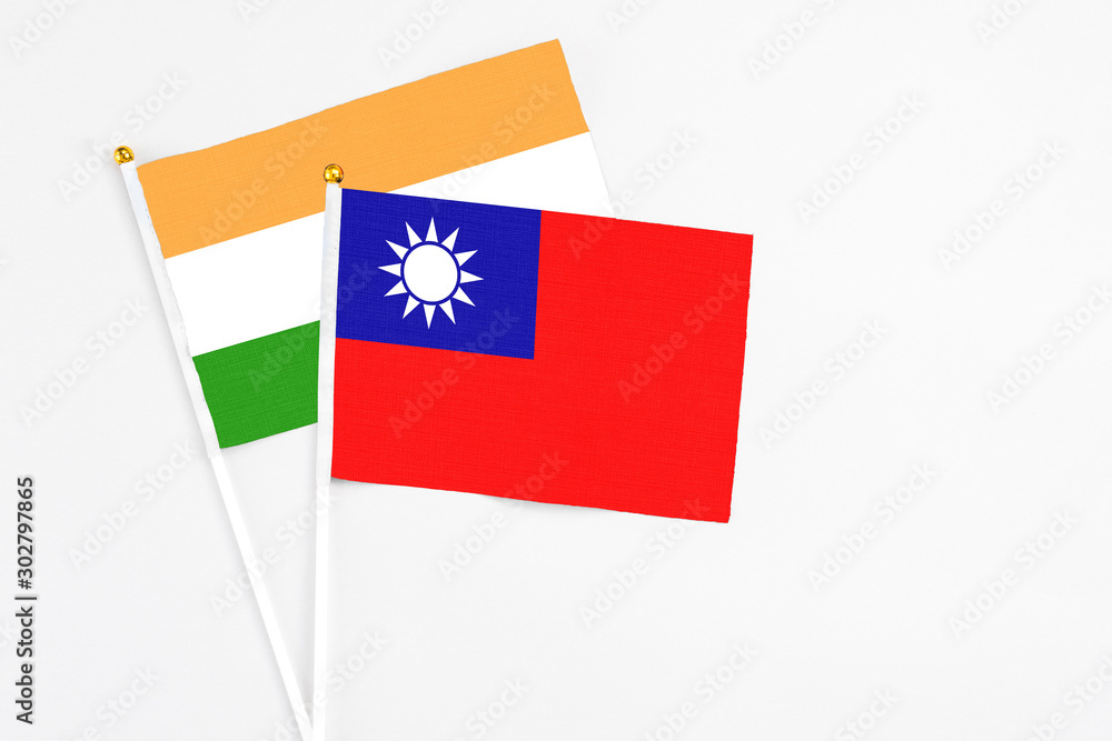 Taiwan and India stick flags on white background. High quality fabric, miniature national flag. Peaceful global concept.White floor for copy space.