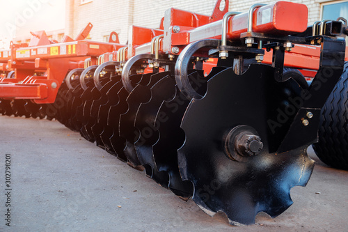 Принти на полотні Working parts of new modern agricultural disc harrow for tillage