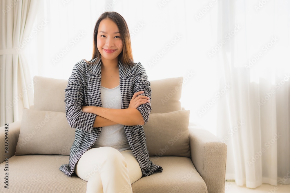 Portrait beautiful young asian women happy smile relax sitting on sofa chair Portrait beautiful young asian women happy smile relax sitting on sofa chair