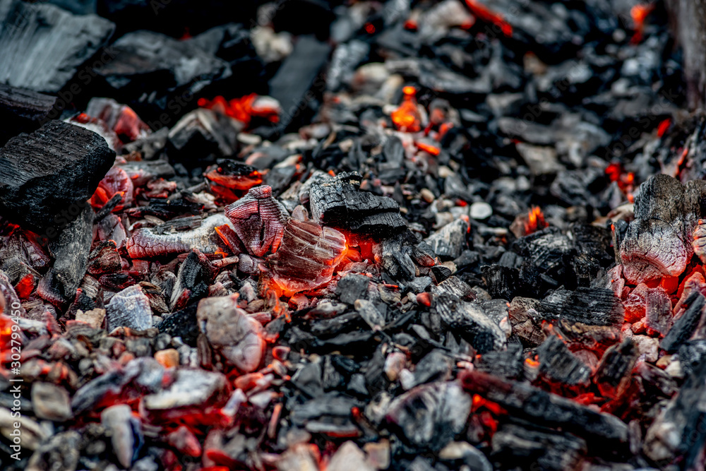 burning coals, fading charcoal, barbecue season. close-up photo burning coals, fading charcoal, barbecue season. close-up photo