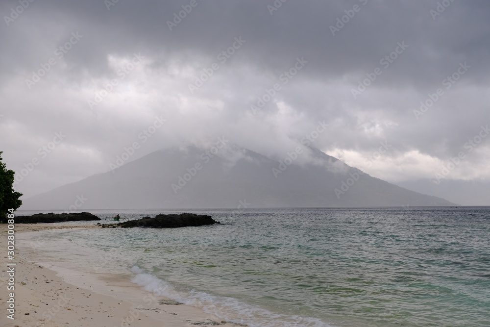 Indonesia Alor - beach and vulcano in background