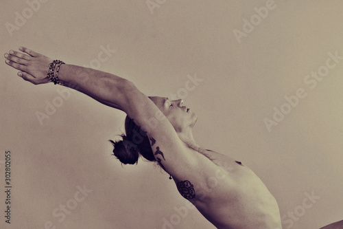 Artistic black and white art photo of man in yoga asana photography. 