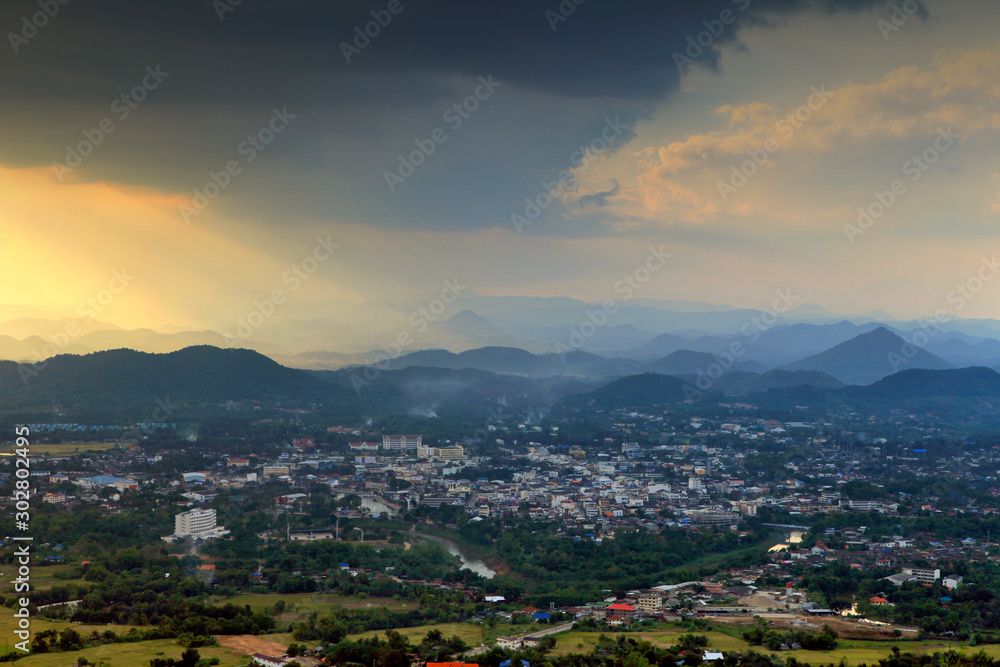 View of Loei Province, Thailand. Taken from Phu Bo bid Mountain in the evening with clouds and light rays.