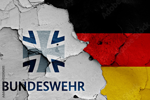 flags of Bundeswehr and Germany painted on cracked wall photo