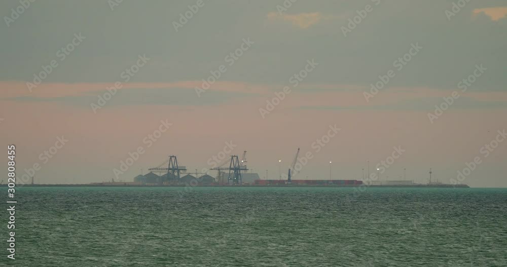 Commercial Docks in the Sea at Sunset, Progreso, Mexico Commercial Docks in the Sea at Sunset, Progreso, Mexico