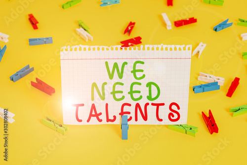 Handwriting text We Need Talents. Conceptual photo new recruitment Making interviews Choose creative showing Colored clothespin papers empty reminder yellow floor background office