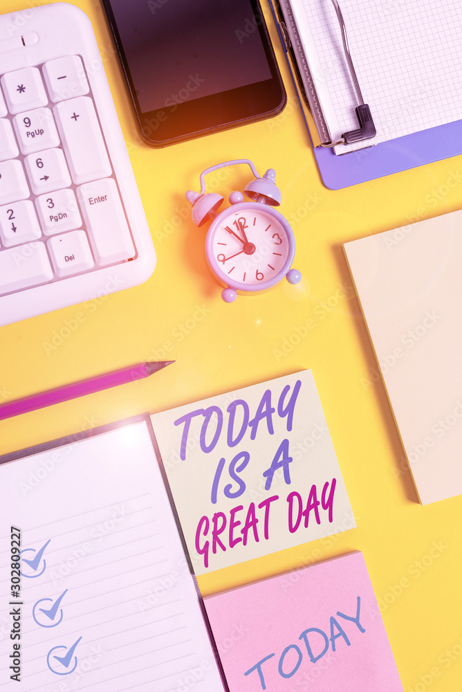 Writing note showing Today Is A Great Day. Business concept for Enjoying the moment great weather Having fun White paper with copy space with paper clips clock and pc keyboard