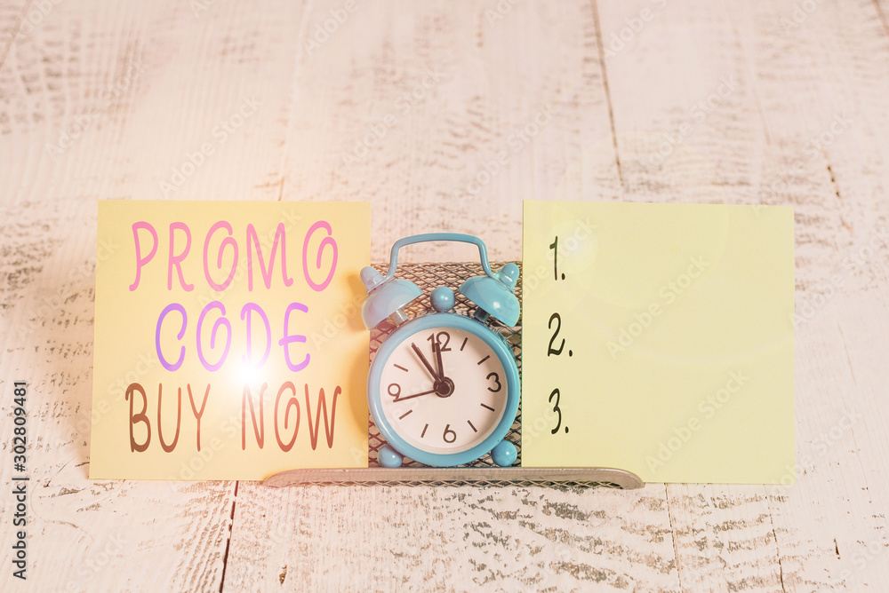 Writing note showing Promo Code Buy Now. Business concept for Giving great discount by entering special words Mini blue alarm clock standing above buffer wire between two paper Writing note showing Promo Code Buy Now. Business concept for Giving great discount by entering special words Mini blue alarm clock standing above buffer wire between two paper