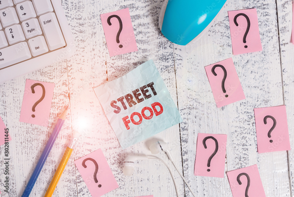 Writing note showing Street Food. Business concept for cooked food sold by vendors in a street or other public location Writing tools and scribbled paper on top of the wooden table Writing note showing Street Food. Business concept for cooked food sold by vendors in a street or other public location Writing tools and scribbled paper on top of the wooden table