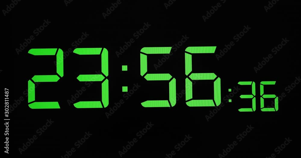 Stock 4k. Timelapse, time lapse of digital number clock on black background. Royalty high-quality stock video footage time lapse of green digital number clock with black background too fast to 24 hour