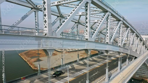 Aerial panning shot along the newly elevated Bayonne Bridge. The Bayonne Bridge is an arch bridge spanning the Kill Van Kull connecting Bayonne, NJ with Staten Island, NYC photo