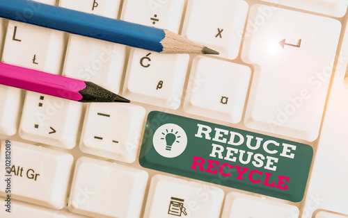 Text sign showing Reduce Reuse Recycle. Business photo showcasing environmentallyresponsible consumer behavior White pc keyboard with empty note paper above white background key copy space
