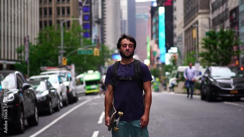 Wallpaper Mural Portrait of caucasian skateboarder male standing in street, Manhattan New York. Young confident male with skateboard. Concept of urban healthy active lifestyle, adventure, american youth, hipster mill Torontodigital.ca