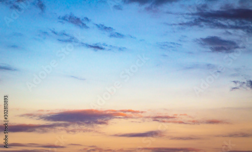 Photography Soft twilight sky with blue and orange clouds at dawn