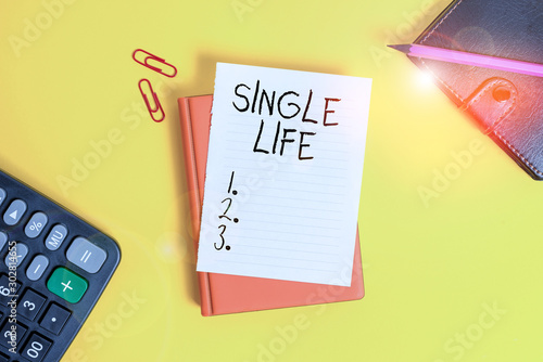 Text sign showing Single Life. Business photo showcasing not vowed to someone or something else Umarried demonstrating Pile of empty papers with copy space on the table photo