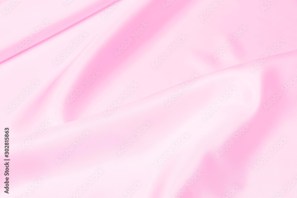 Plastic pink satin fabric texture soft blur background Plastic pink satin fabric texture soft blur background