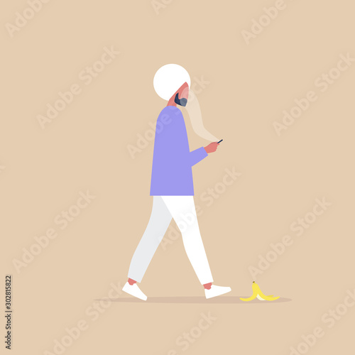 Modern lifestyle, Millennial indian male character addicted to a smartphone stepping on a banana peel