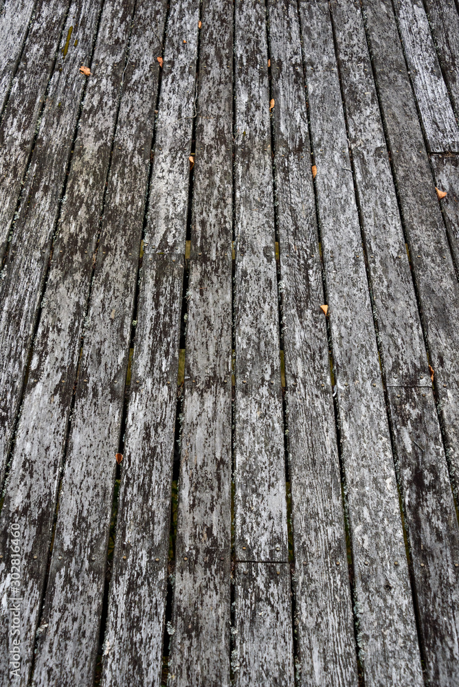 Obraz premium Weathered cedar deck in need of replacement, pattern and texture