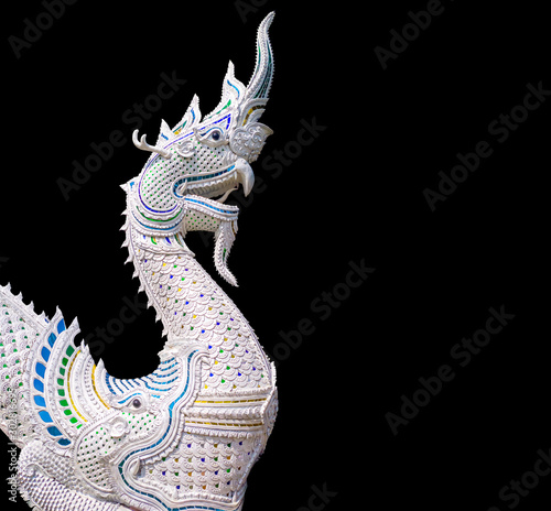 White Serpent king or king of naga statue isolated on black background