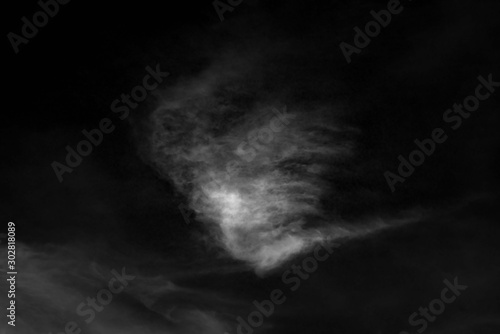 white cloud and black sky textured background photo