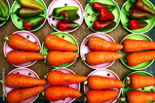 Carrots and bell pepper sold at a market