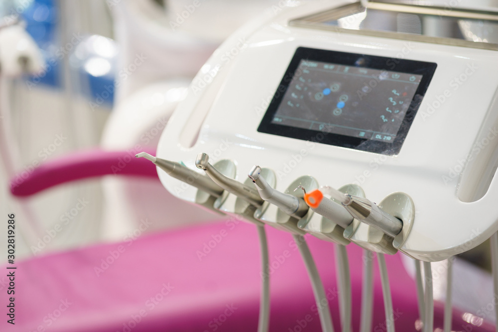 Dental equipment at the clinic close-up. Medical instruments for examining and treating patients. Dental equipment at the clinic close-up. Medical instruments for examining and treating patients.