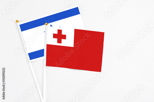 Free Download Tonga and Israel stick flags on white background. High quality fabric, miniature national flag. Peaceful global concept.White floor for copy space. - GFXLoad
