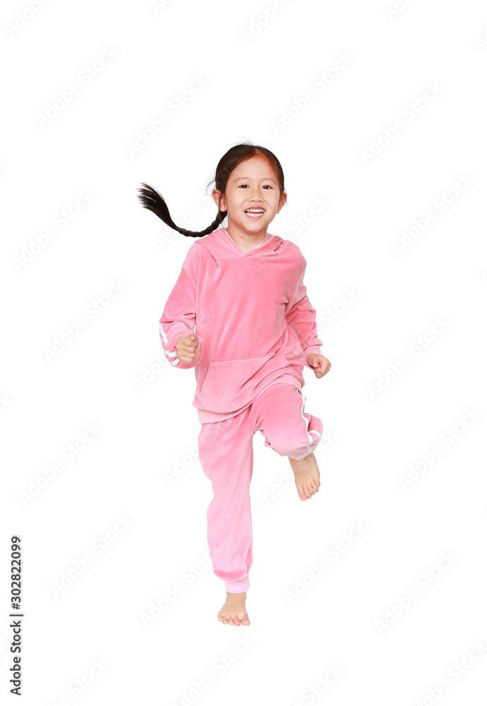 Portrait of smiling little Asian kid girl in pink tracksuit or sport cloth doing exercises isolated on white background. Portrait of smiling little Asian kid girl in pink tracksuit or sport cloth doing exercises isolated on white background.