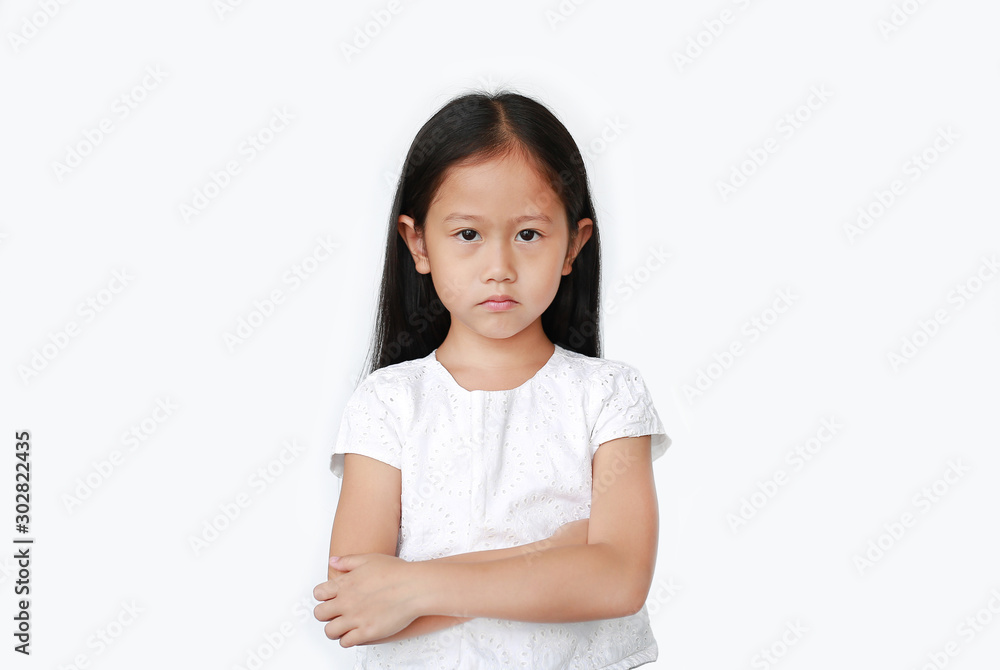 Angry caucasian little girl show frustration and disagreement face with expression cross one's arm isolated over white background. Person with Negative emotion concept. Angry caucasian little girl show frustration and disagreement face with expression cross one's arm isolated over white background. Person with Negative emotion concept.