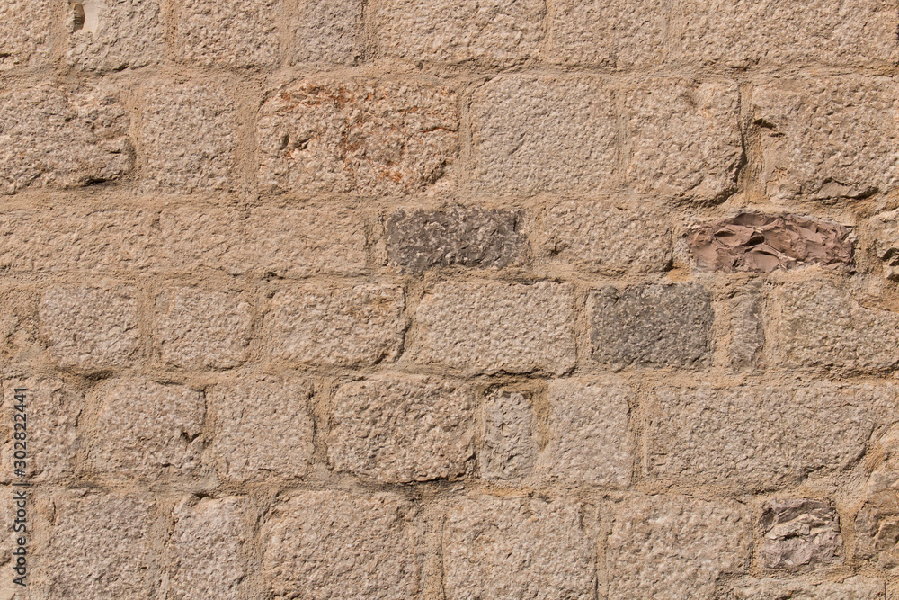 Background texture of the old fortress stone wall. Conceptual background for designers. Selective focus. Background texture of the old fortress stone wall. Conceptual background for designers. Selective focus.