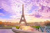 Eiffel Tower at sunset in Paris, France. Romantic travel background